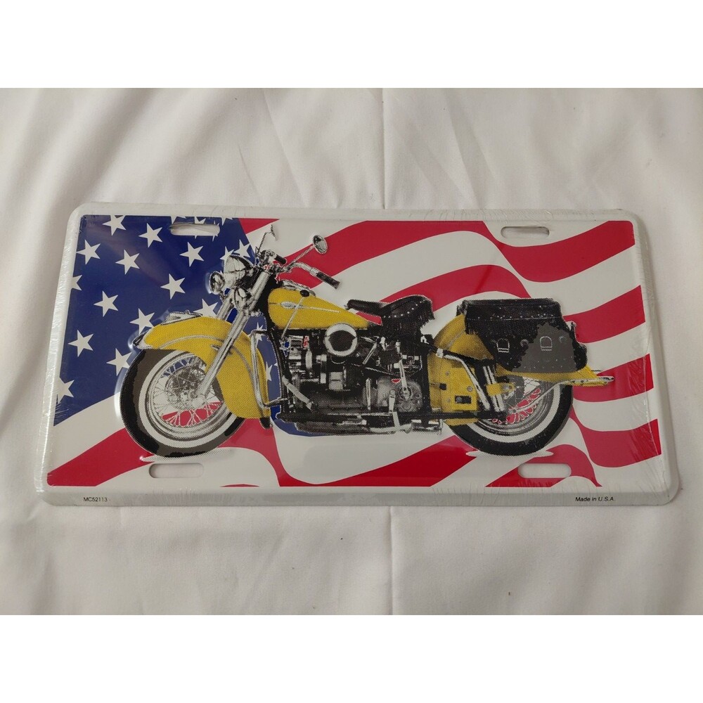 Truck & Car Metal Vanity Plate Yellow Motorcycle Against an American Flag